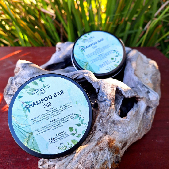 Eco-friendly Shampoo Bar in reusable tins, featuring plant-based ingredients like Hemp Seed Oil and Prickly Pear Oil, suitable for all hair types.