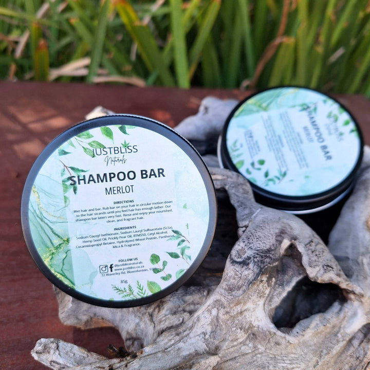 Eco-friendly Shampoo Bar in reusable tin, crafted with natural ingredients for all hair types, featuring Merlot fragrance.
