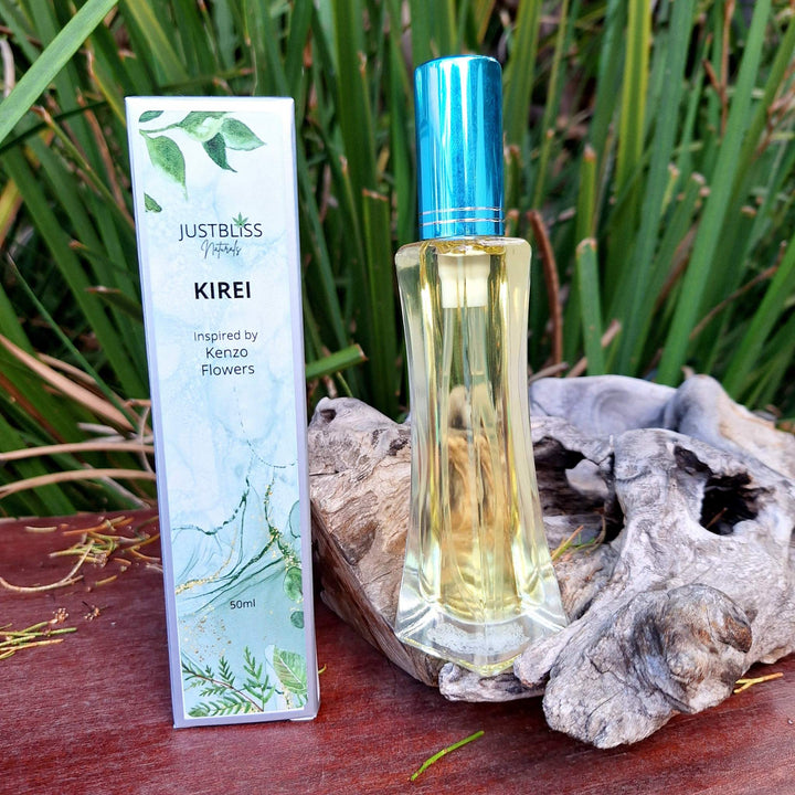 Kirei floral perfume bottle (50ml) with packaging, inspired by Kenzo Flowers, displayed outdoors.