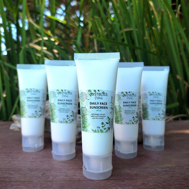 Plant-based sun protection and after-sun lotion combo displayed outdoors.