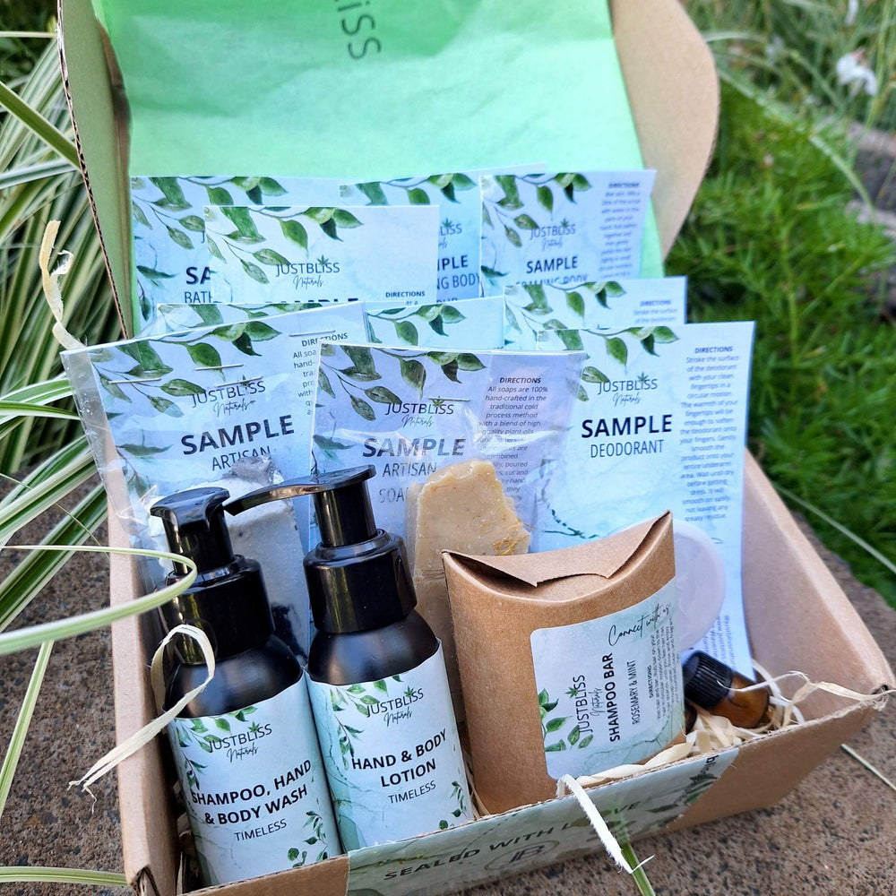 Luxury plant-based skincare and body care starter kit with samples, featuring JUSTBLiSS products like hand and body wash, lotion, shampoo bar, and more in an eco-friendly box.