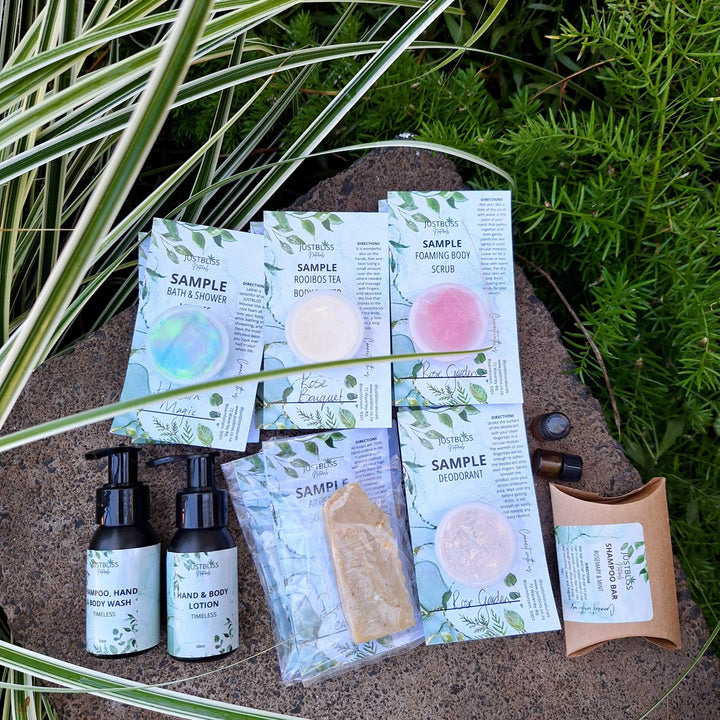 Luxury plant-based skincare and body care starter kit with samples, featuring hand and body wash, lotion, shampoo bar, body scrub, artisan soap, deodorant, bath mousse, facial oil, and prickly pear seed oil.