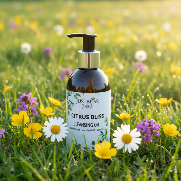 JUSTBLiSS Naturals facial toner, cleansing oil, facial oil and scrub in a natural meadow setting