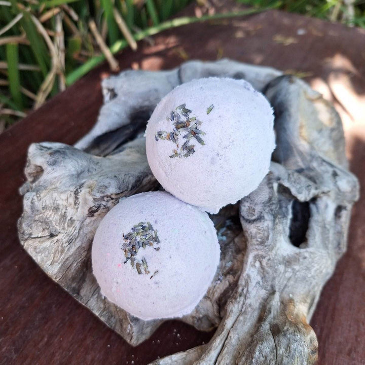 Christmas themed bath bombs with hemp oil and lavender on rustic wood.