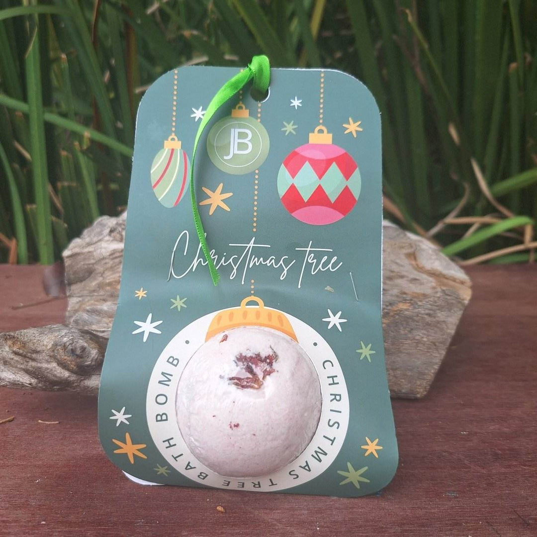 Christmas themed bath bomb with holiday packaging, featuring hemp oil and soothing lavender.