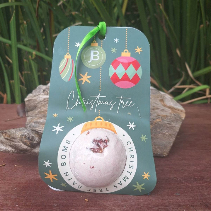 Christmas themed bath bomb with holiday packaging, featuring hemp oil and soothing lavender.