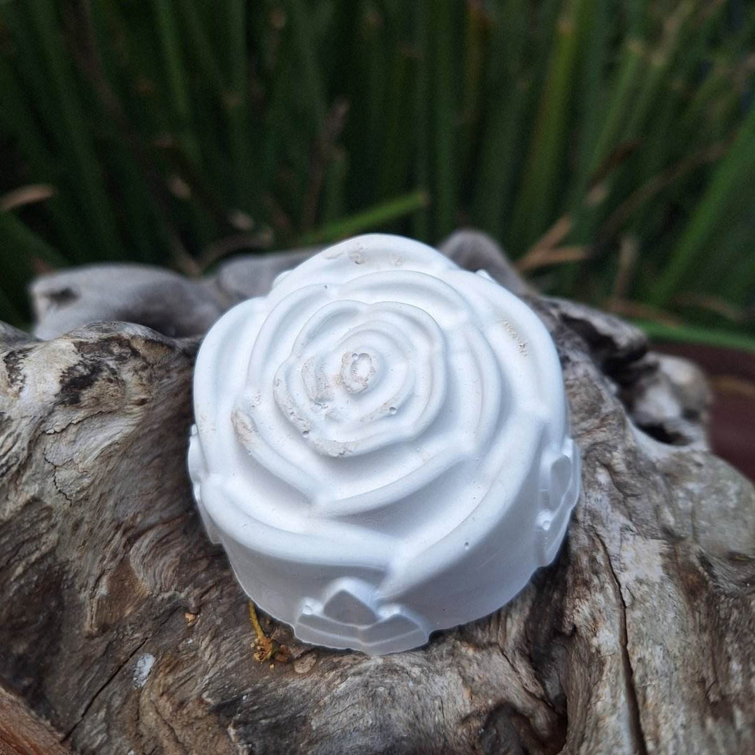 Clay diffuser stone on wood surface for aromatherapy atmosphere.