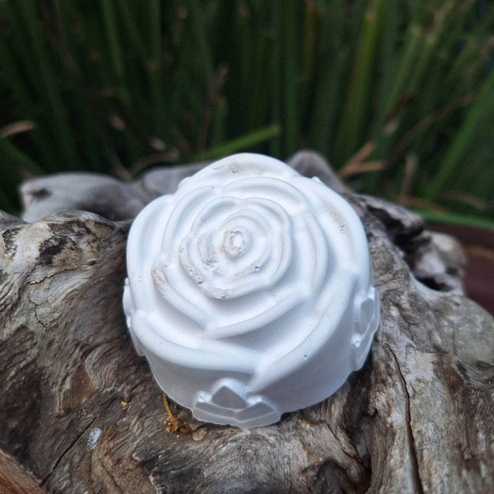 Clay diffuser stone on wood surface for aromatherapy atmosphere.