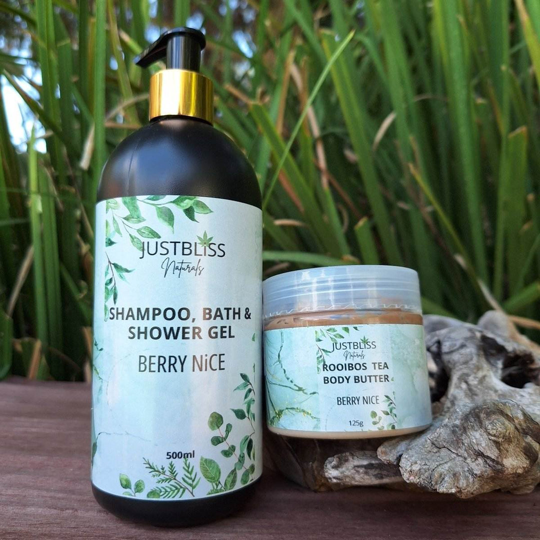 COMBO BODY WASH & BODY BUTTER: Berry Nice set, featuring 500ml shampoo, bath & shower gel, and 125g Rooibos tea body butter, displayed outdoors.
