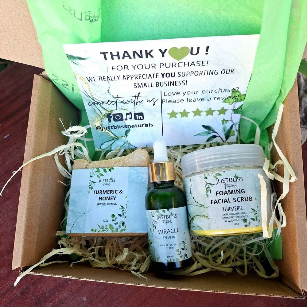Turmeric facial Care combo box with soap bar, facial oil, and foaming facial scrub.