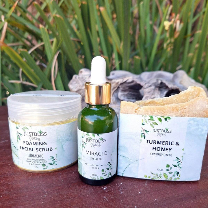Turmeric Facial Care combo including foaming facial scrub, miracle facial oil, and turmeric & honey soap bar.