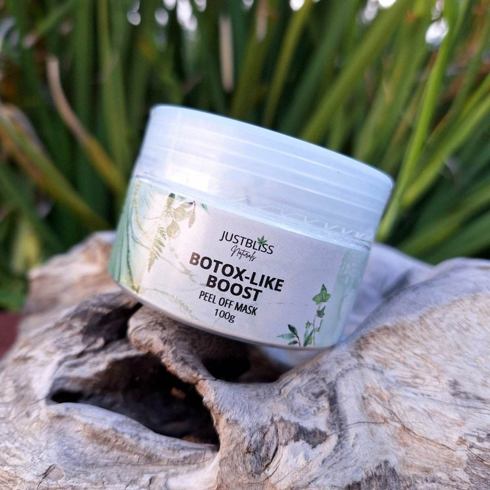 Clay Face Mask by Justbliss, Botox-like boost, peel-off, 100g container on natural background.