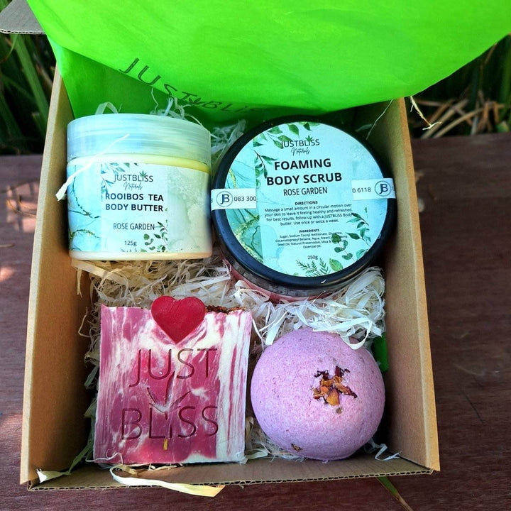 Romantic Rose Garden Gift Box with body scrub, rooibos tea body butter, soap bar, and bath bomb.