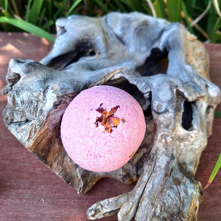 Rose Garden Romantic Gift Box featuring bath bomb amidst natural setting.