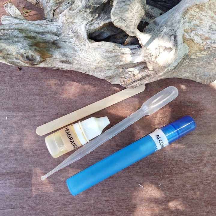DIY Soap Making Kit with glycerin soap ingredients and tools on wooden surface.