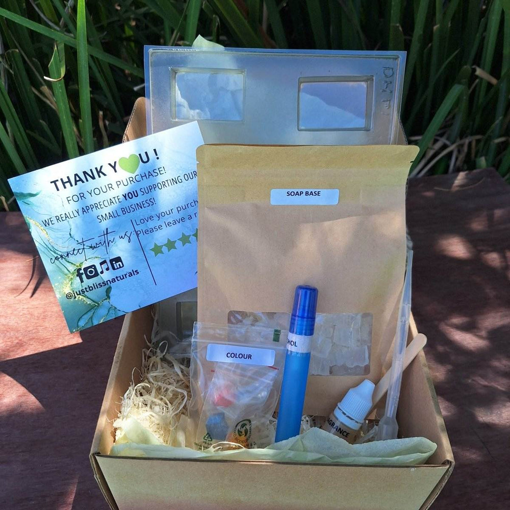 DIY Soap Making Kit with glycerin base, fragrance oil, colorants, mold, and tools for home crafting.