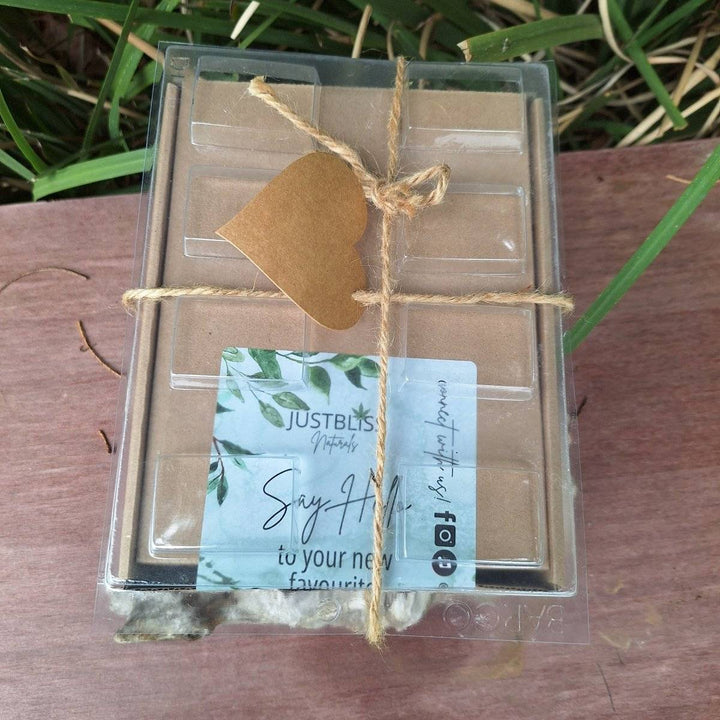 DIY Soap Making Kit soap making gift box on wooden surface, includes glycerin base, fragrance oils, colorants, and accessories for homemade soap crafting.