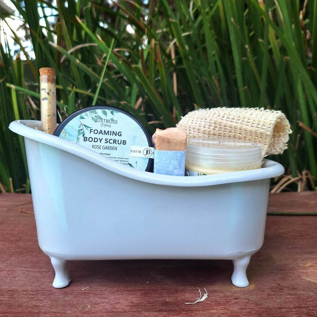 Limited edition 'Spa in a Bath' gift box with body scrub, bath salt, artisan soap, sisal soap saver, and body butter in a small bath container.