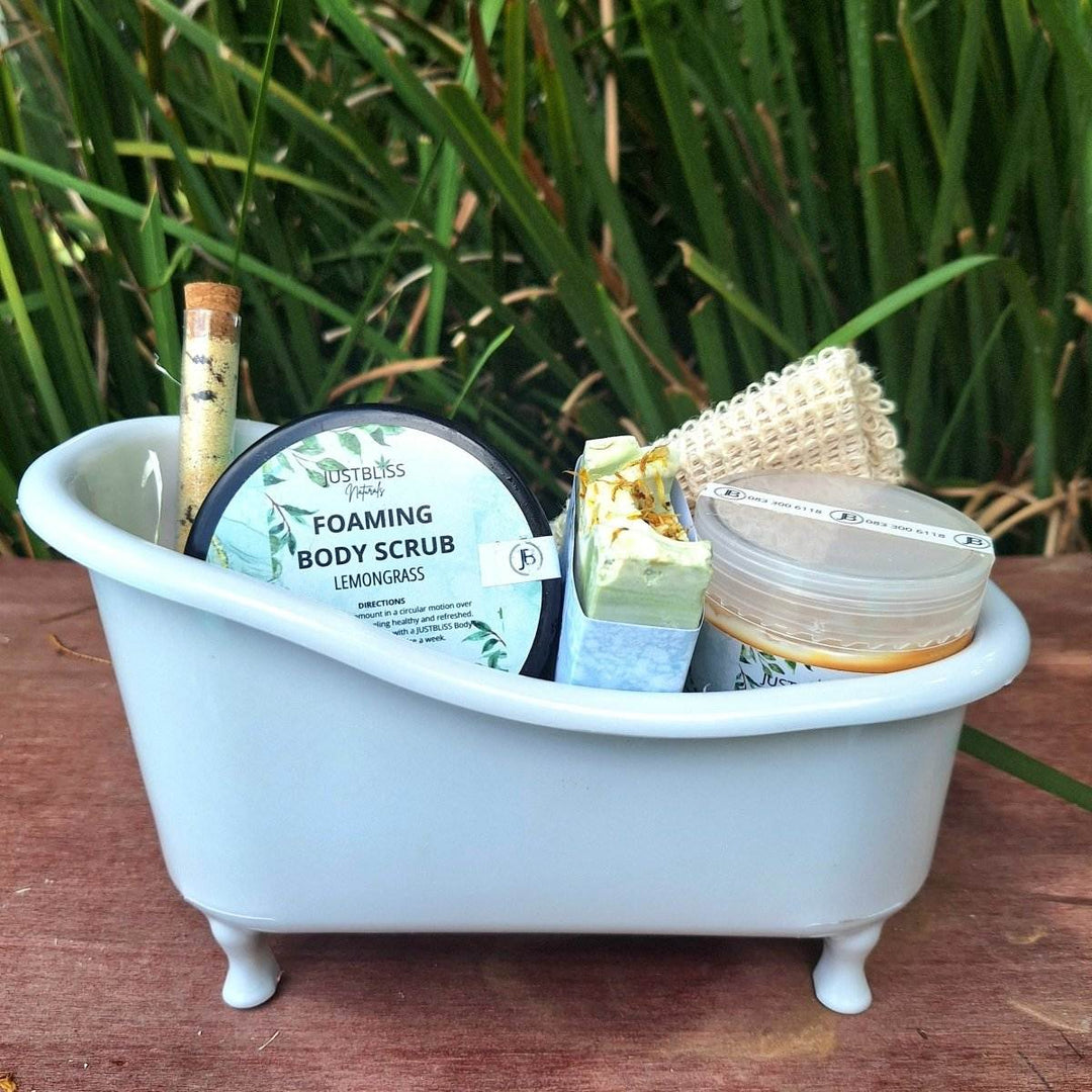 Gift box spa set with body scrub, bath salt, artisan soap, sisal soap saver, and body butter in a mini bath tub.
