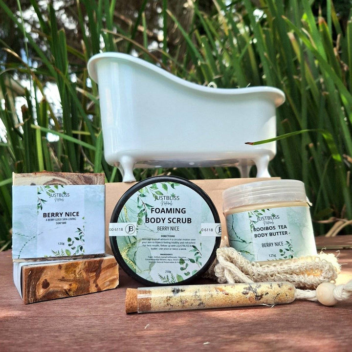 Limited edition spa gift box set with body scrub, bath salt, artisan soap, sisal soap saver, rooibos tea body butter, and a small bath.