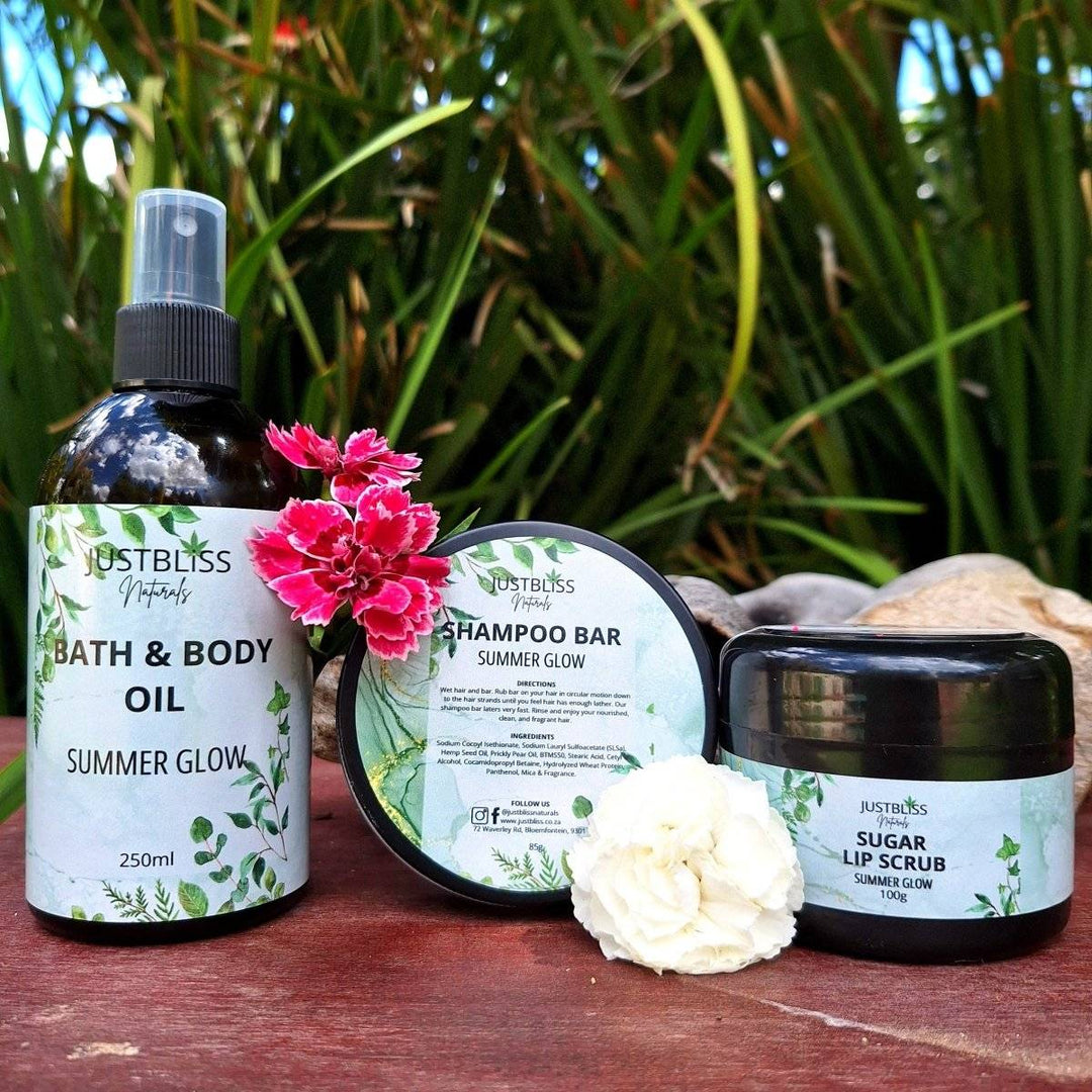 Summer Glow Gift Box with body oil, shampoo bar in tin, and lip scrub, featuring lemongrass and ginger fragrance, for radiant summer beauty.