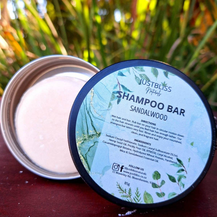 Eco-friendly Shampoo Bar in reusable tin with sandalwood scent, suitable for all hair types; enhances hair care with plant-based ingredients.