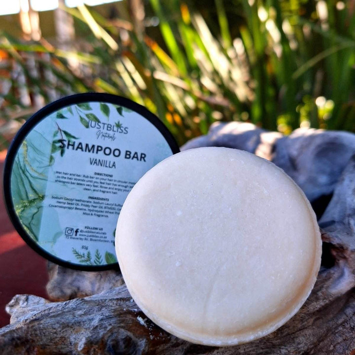 Eco-friendly vanilla Shampoo Bar in reusable tin, suited for all hair types.
