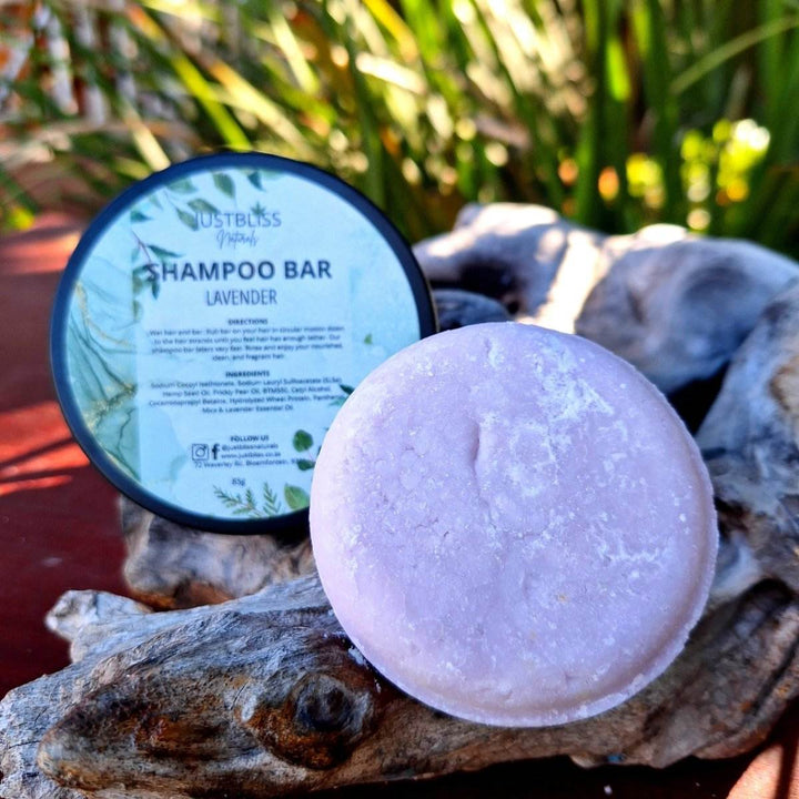 Eco-friendly lavender Shampoo Bar in a reusable tin for all hair types, featuring plant-based ingredients for cleansing, hydration, and strengthening.