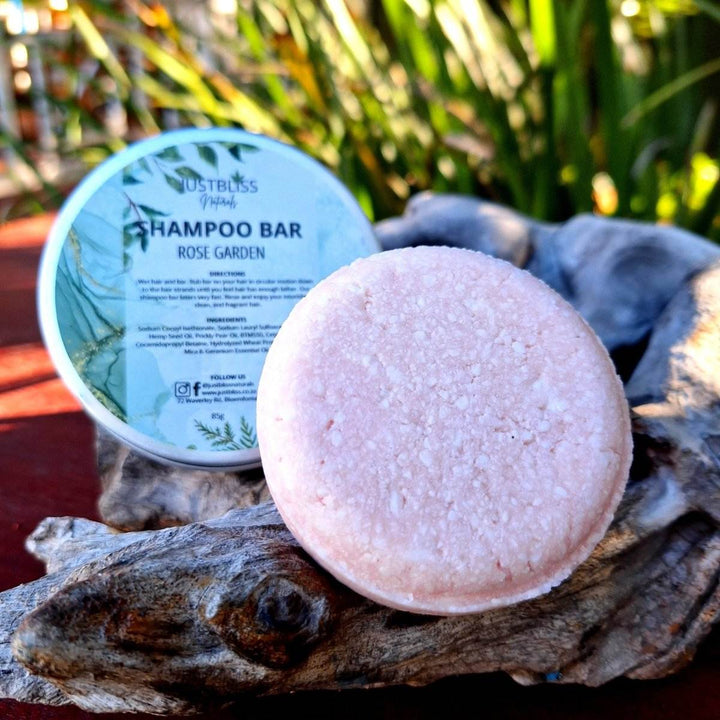 Eco-friendly Shampoo Bar in a reusable tin with Rose Garden scent for all hair types, featuring plant-based ingredients for hydration and strength.