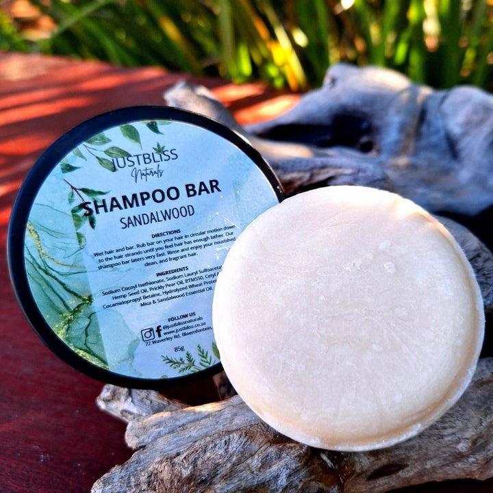 Eco-friendly sandalwood Shampoo Bar in reusable tin for all hair types.