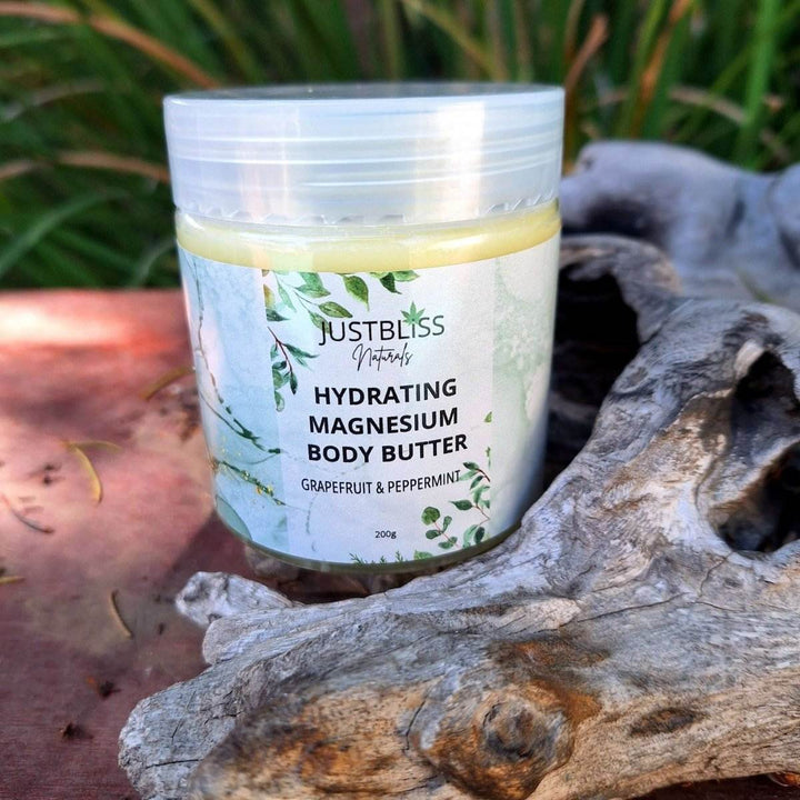Magnesium Whipped Body Butter jar with grapefruit and peppermint scent; extremely hydrating formula for muscle relaxation and soft skin.