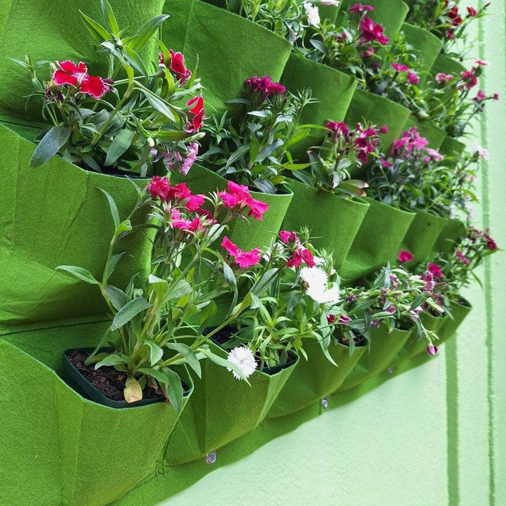 Vertical living wall planter with vibrant flowers enhancing home and office decor.