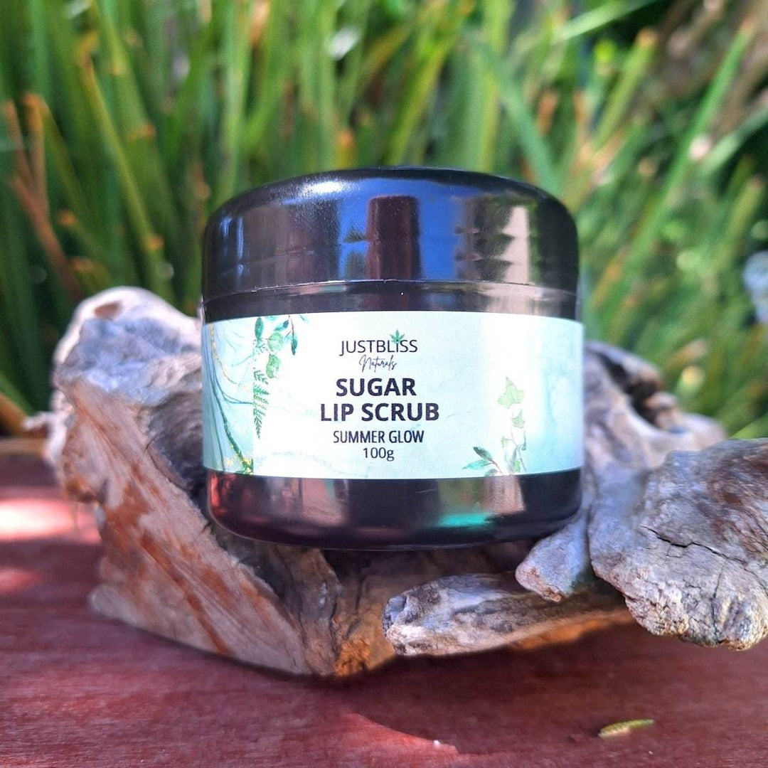 Summer Glow Sugar Lip Scrub jar on natural wood background.