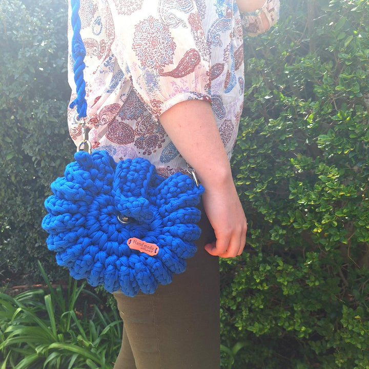 Handcrafted handbag with unique design, handmade with cotton wool for natural elegance.