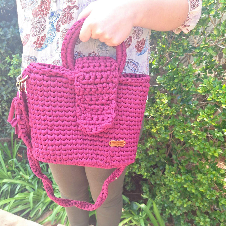 Handcrafted handbag made of cotton wool, showcasing unique design and spacious interior.