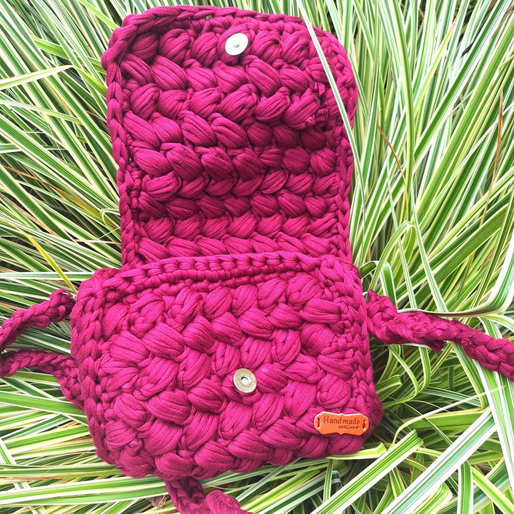Hand-crafted handbag with an open design, showcasing intricate hand-stitching for a unique accessory.