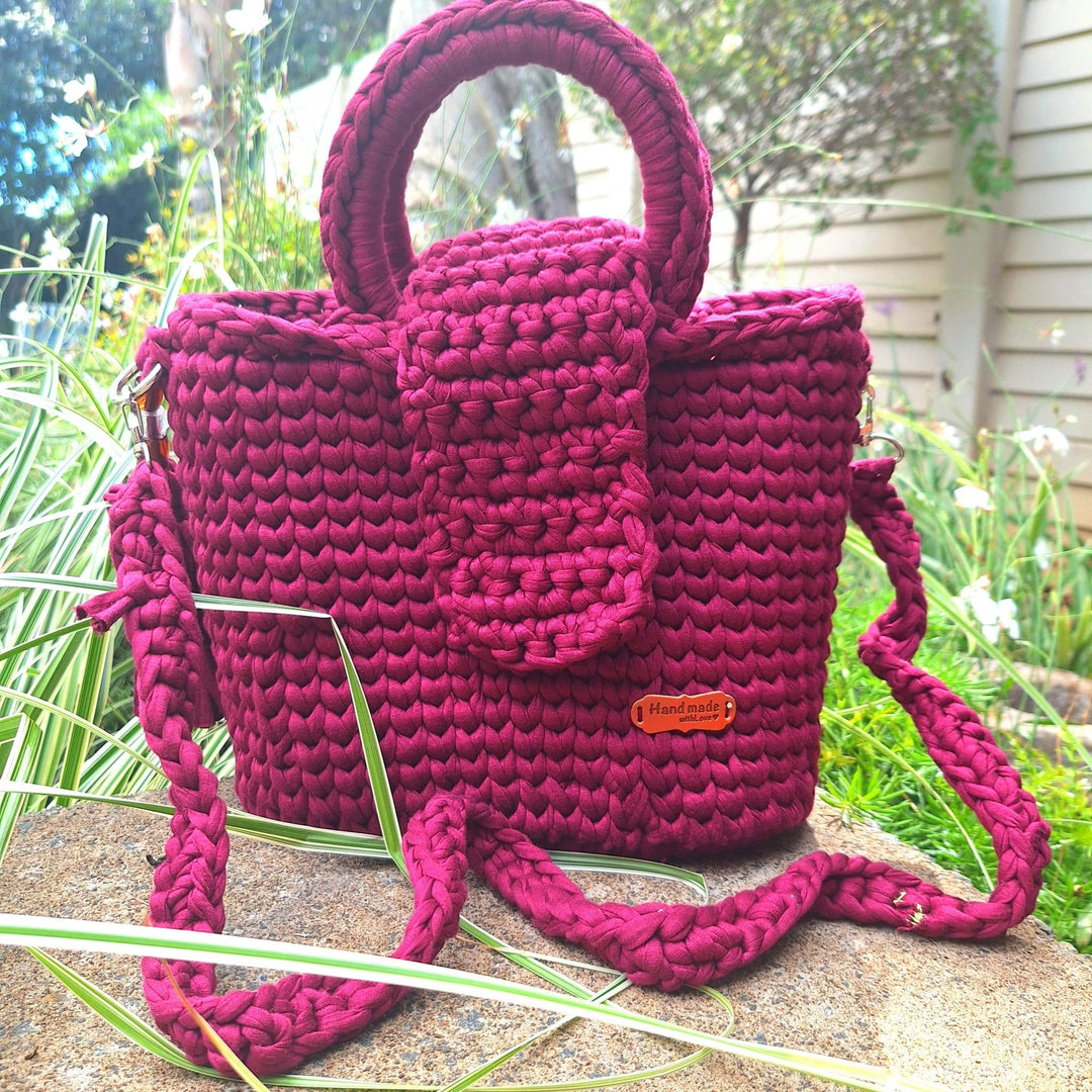 Hand-crafted handbag made from cotton wool, featuring a unique, hand-stitched design.
