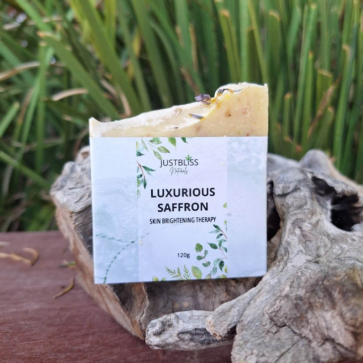 Luxurious saffron soap bar on natural backdrop, skin brightening therapy.